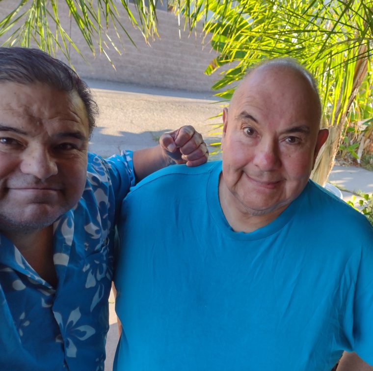 Rene and Bobby Joe Carrasco standing side-by-side, smiling.